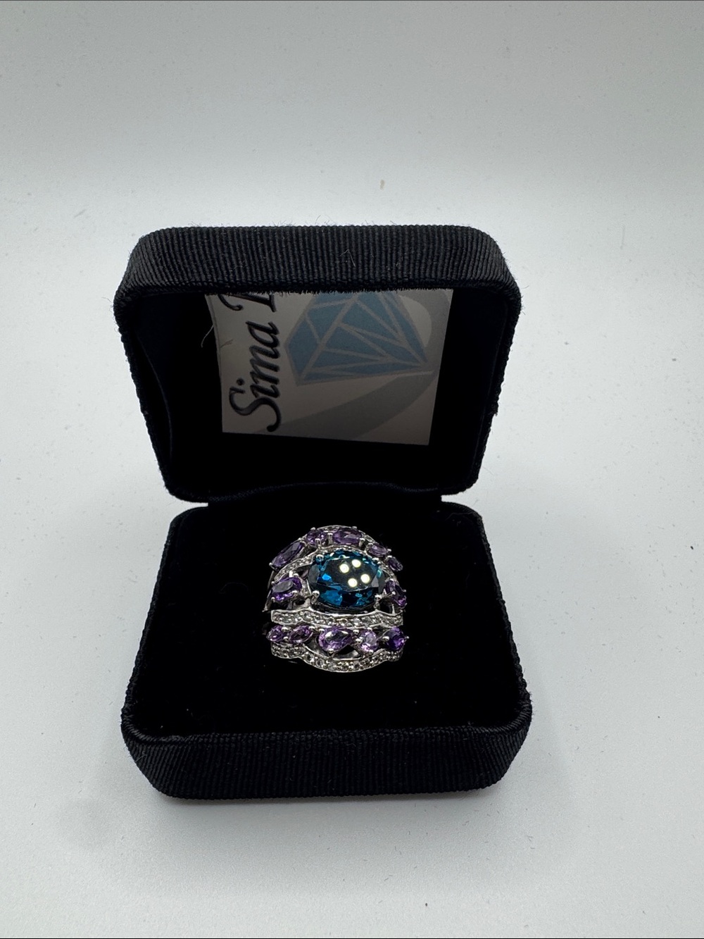 Sima K Blue Center Stone with Purple Accents Cocktail Ring